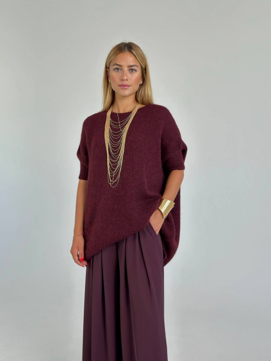 Pantaloni ampi con pieghe decorative