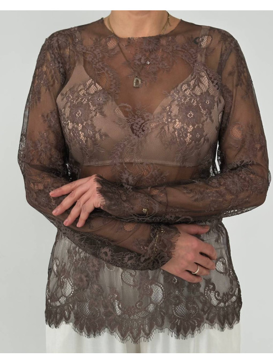 Blusa in pizzo trasparente