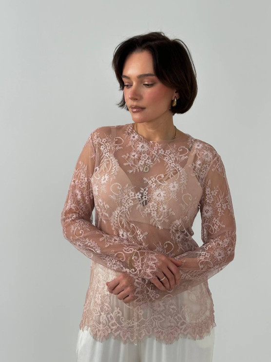 Blusa in pizzo trasparente