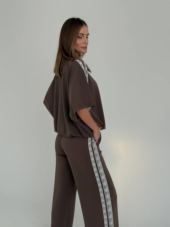 Pantaloni morbidi con bande decorative