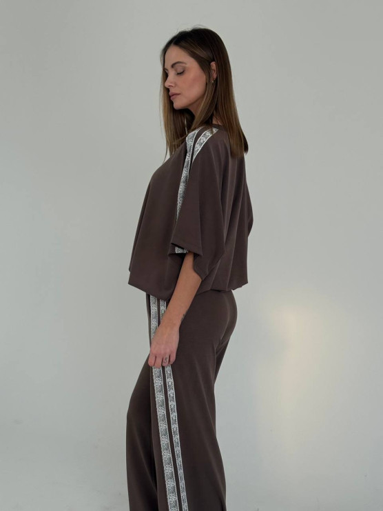Soft trousers with decorative side bands