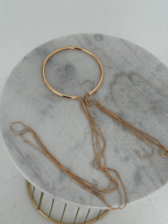 Circular necklace with hanging strands