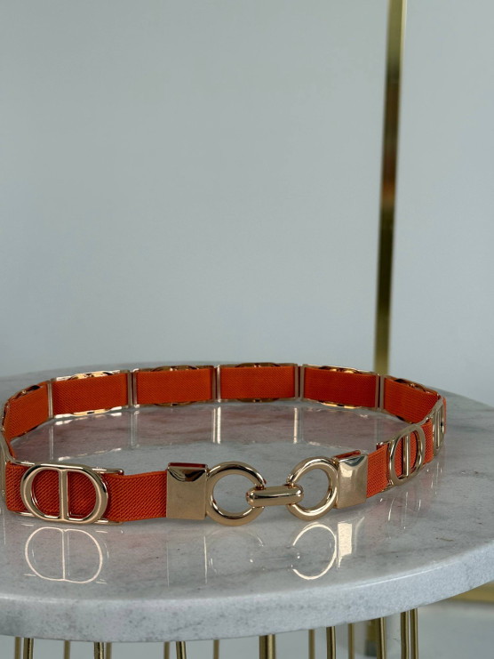 Elastic belt with metal rings