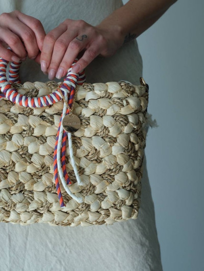 Handwoven bag with wrapped handles