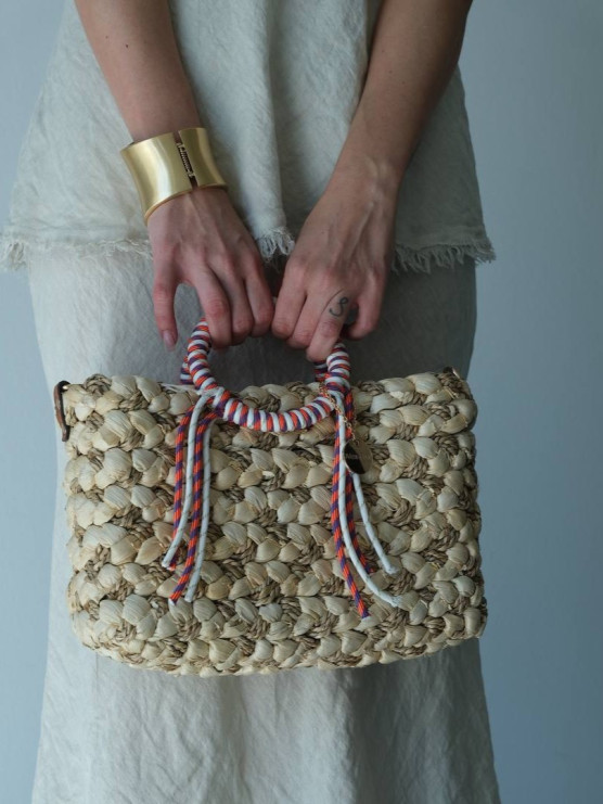 Handwoven bag with wrapped handles