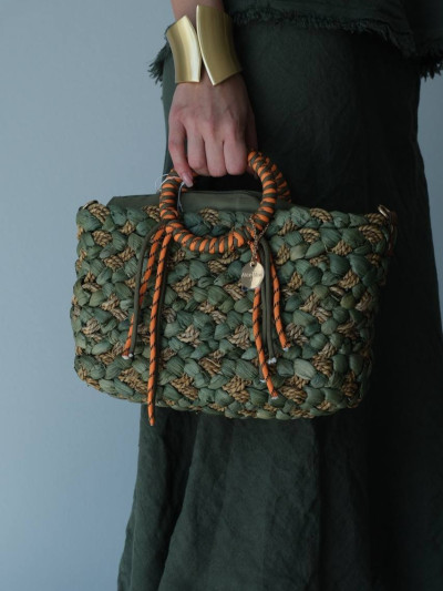 Handwoven bag with wrapped handles