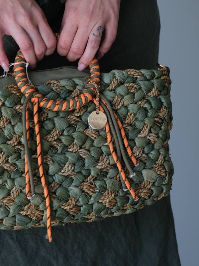 Handwoven bag with wrapped handles