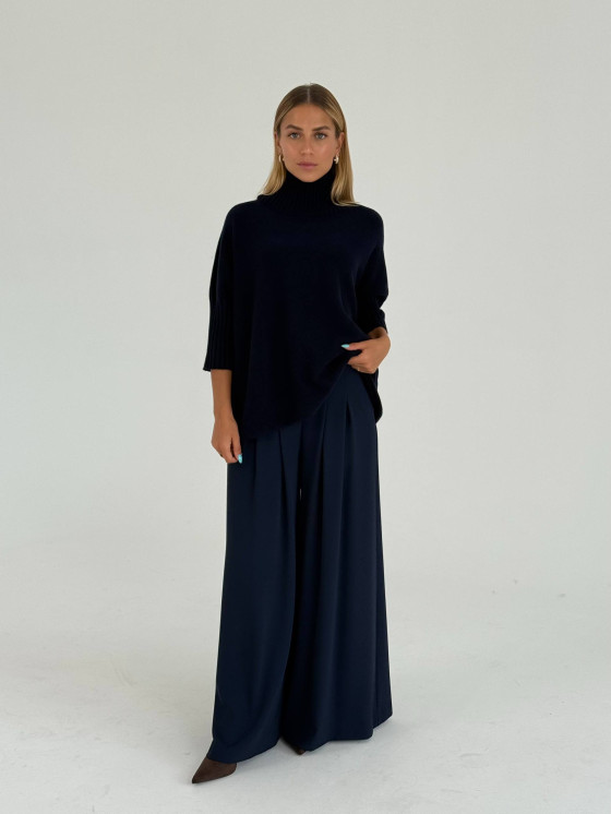 Pantaloni ampi con pieghe decorative